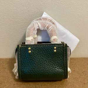 Unopened Coach Rogue bag charm in green / tan